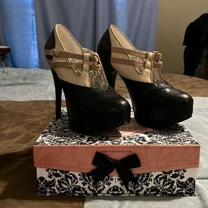 Gently used black and tan Bordello heels